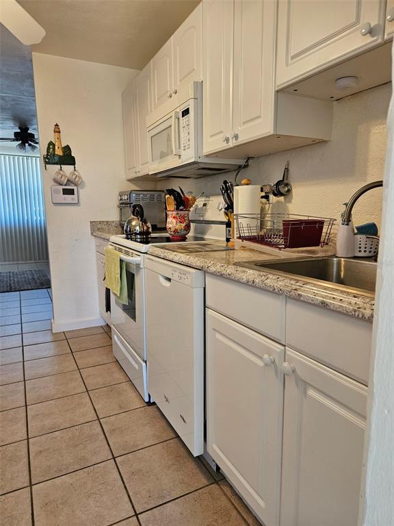 37 Rivershore Drive Ormond Beach, FL 32176 - Photo 12 of 36 a kitchen with stainless steel appliances granite countertop a sink stove and cabinets