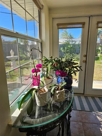 a bedroom with a bed and dresser with mirror