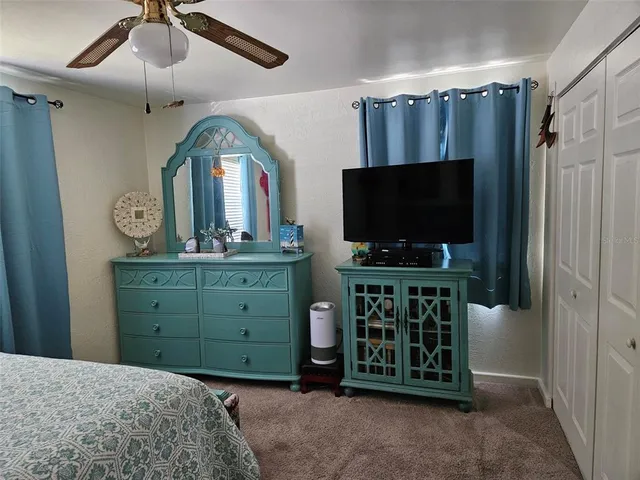 a bedroom with a bed and a dresser