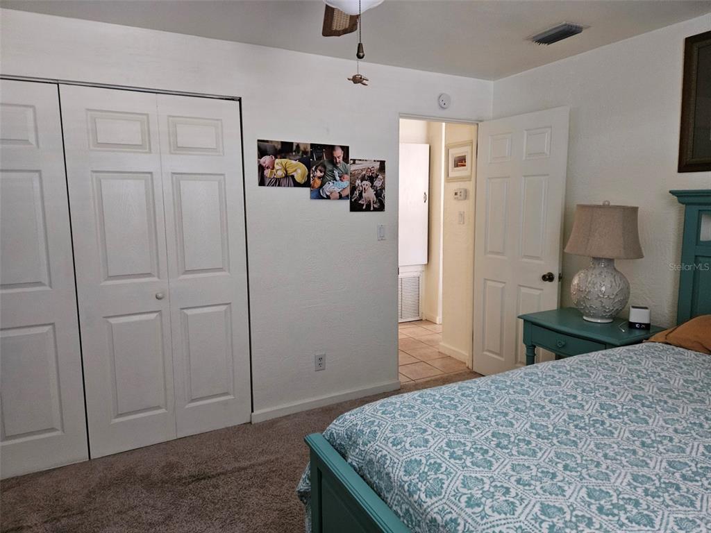 37 Rivershore Drive Ormond Beach, FL 32176 - Photo 20 of 36 a bedroom with a bed and a dresser