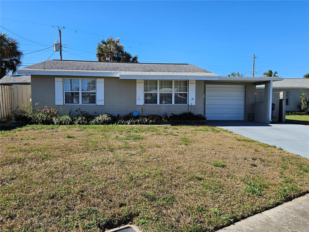 37 Rivershore Drive Ormond Beach, FL 32176 - Photo 2 of 36 a front view of a house with a garden