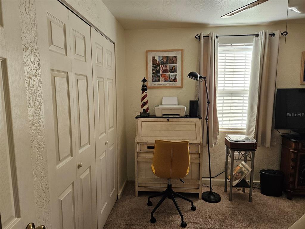 37 Rivershore Drive Ormond Beach, FL 32176 - Photo 21 of 36 a view of a workspace with furniture and a window