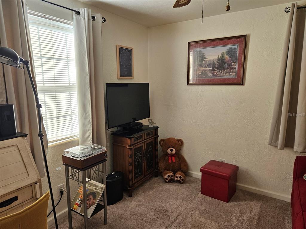37 Rivershore Drive Ormond Beach, FL 32176 - Photo 22 of 36 a living room with furniture and a flat screen tv