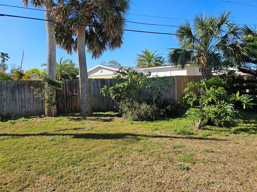 37 Rivershore Drive Ormond Beach, FL 32176 - Photo 27 of 36 a small garden in the middle of a yard