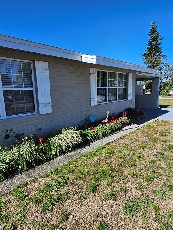 37 Rivershore Drive Ormond Beach, FL 32176 - Photo 3 of 36 a front view of a house with a yard