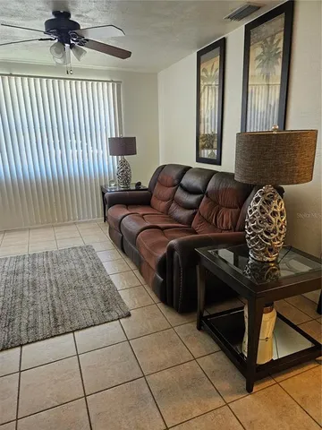 a living room with a black white checkered floor