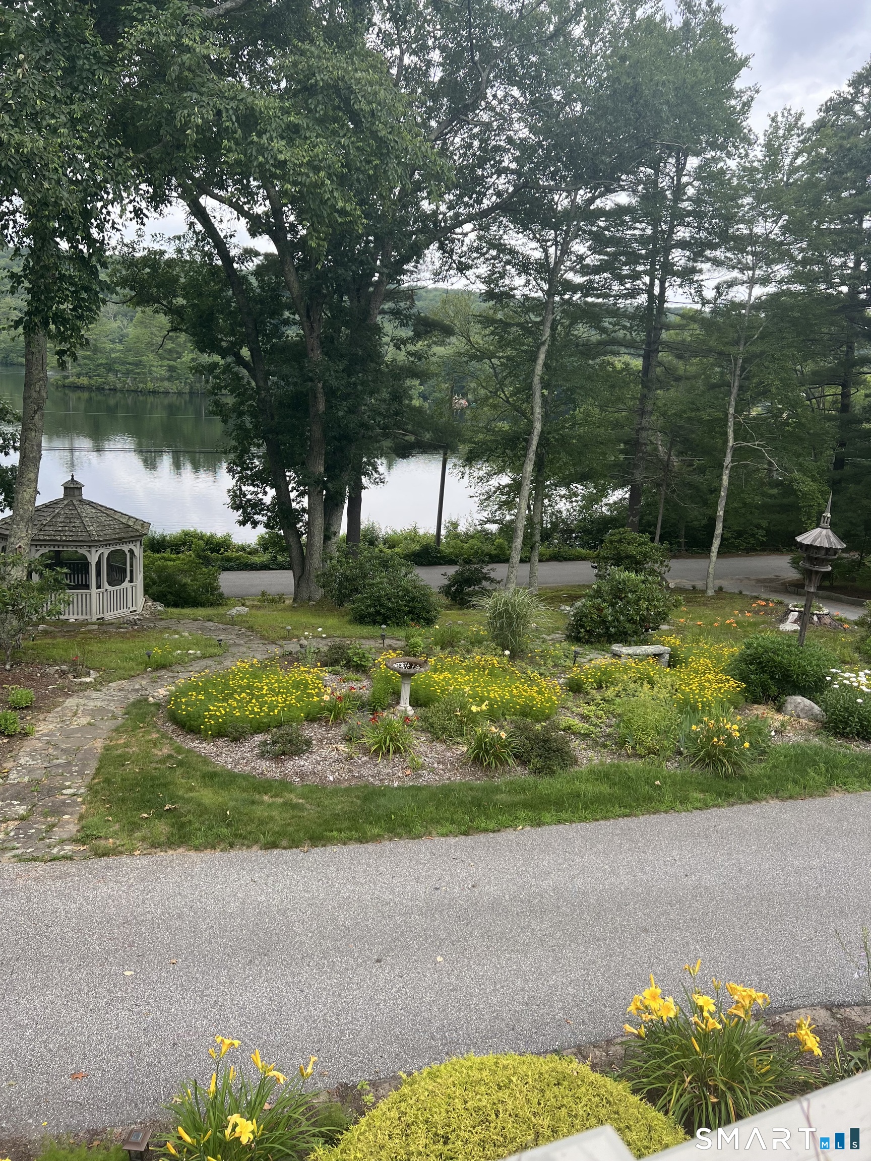 82 Kennerson Reservoir Road Ashford, CT 06278 - Photo 5 of 12 a view of a garden with an outdoor space