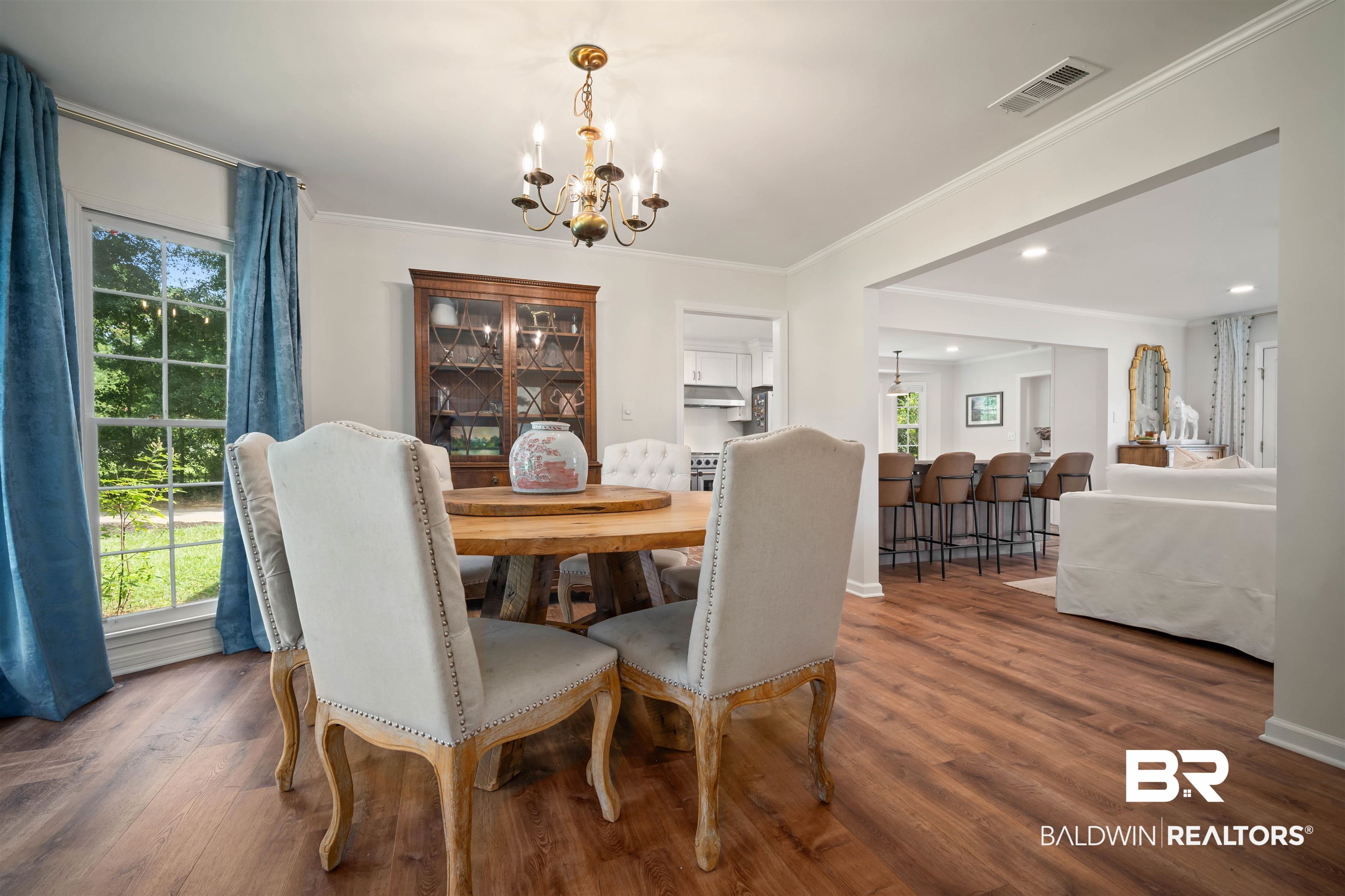 700 Eliza Jordan Road North Mobile, AL 36608 - Photo 13 of 44 Dining space with a chandelier, wood finished floors, and ornamental molding