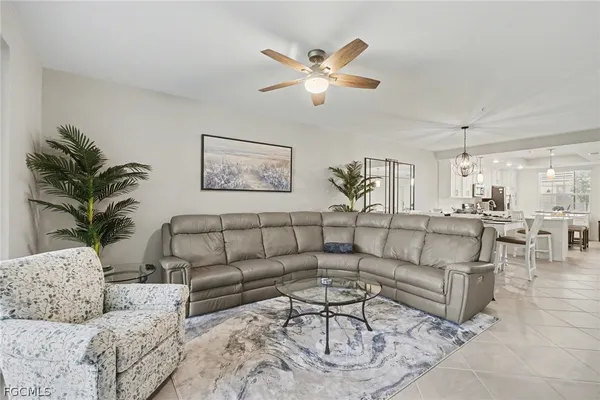a living room with furniture or kitchen and a chandelier