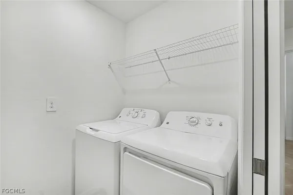a utility room with dryer and washer