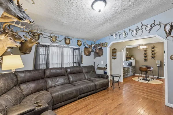a bedroom with a bed and a chandelier