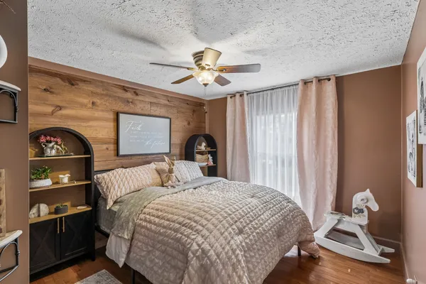 a view of a dining room with furniture wooden floor and chandelier