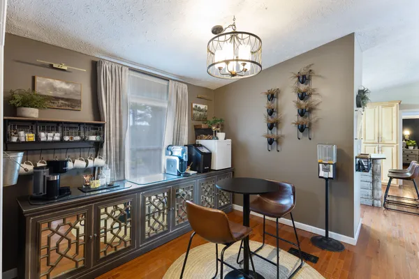 a view of a dining room with furniture and wooden floor