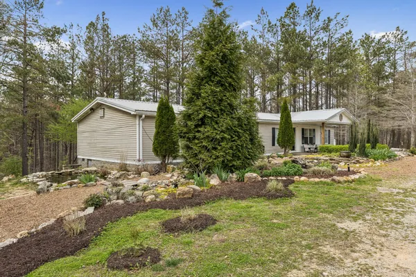 a bathroom with a sink a toilet and shower curtain