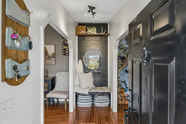 a living room with furniture and a book shelf