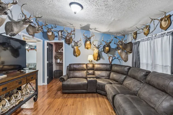 a bedroom with a bed and a chandelier