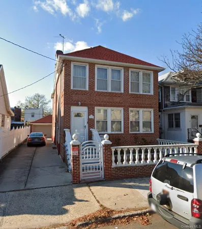 a front view of a house with parking space