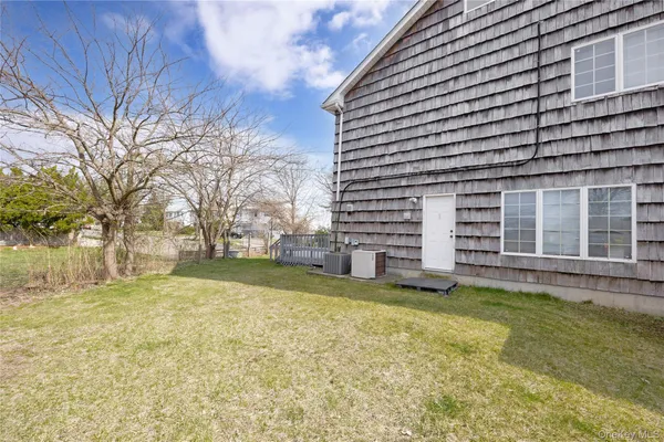 a view of a backyard with a large tree