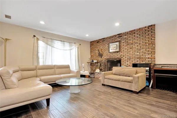 a living room with furniture fireplace and a table