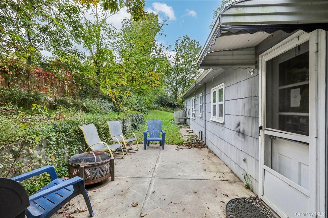 5 Beverly Trail Monroe, NY 10950 - Photo 21 of 24 a view of backyard with outdoor seating and trees