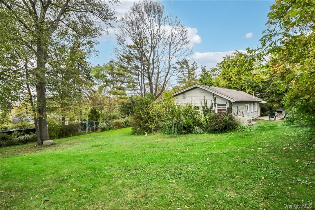 5 Beverly Trail Monroe, NY 10950 - Photo 22 of 24 a view of a house in front of a big yard with large trees