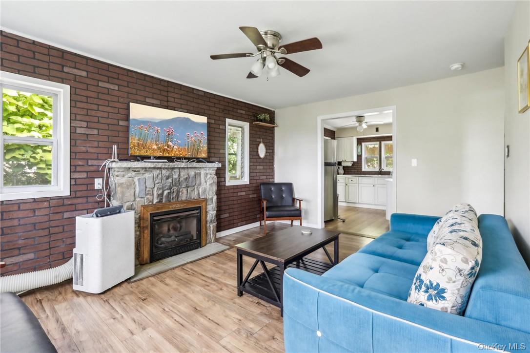 5 Beverly Trail Monroe, NY 10950 - Photo 7 of 24 a living room with furniture and a fireplace