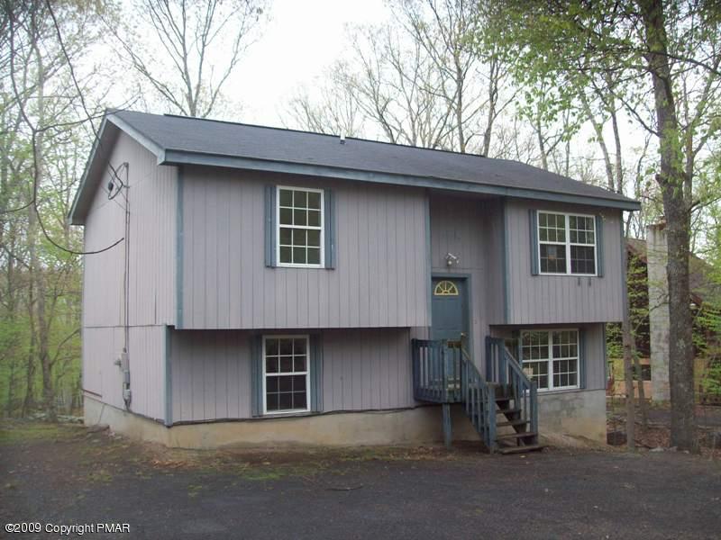 1027 Canterbury Road Bushkill, PA 18324 - Photo 1 of 1 a front view of a house with a yard
