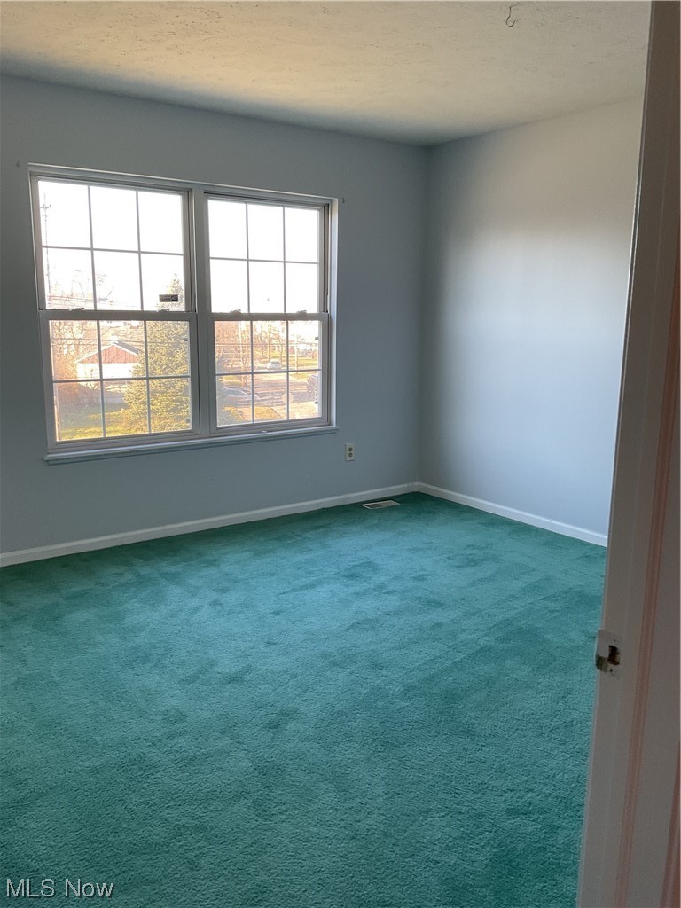 4422 Sexton Road Cleveland, OH 44105 - Photo 15 of 30 Unfurnished room with plenty of natural light and dark carpet