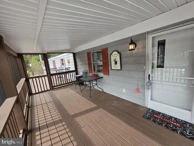a view of a livingroom with furniture and wooden floor