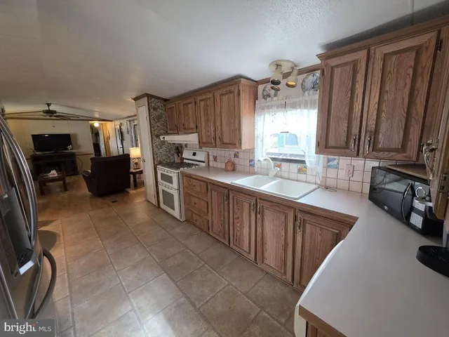 a view of a livingroom with furniture and window