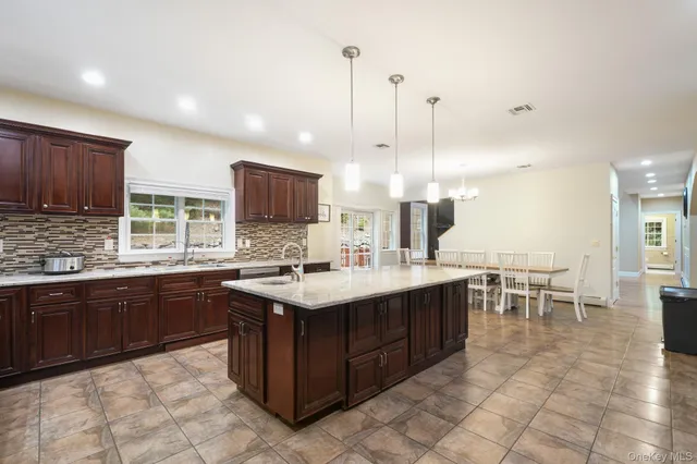 a kitchen with a sink and stove