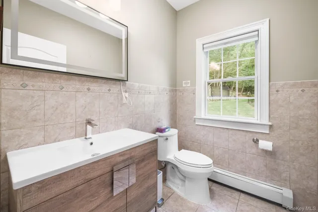 a bathroom with a sink a toilet and a bathtub