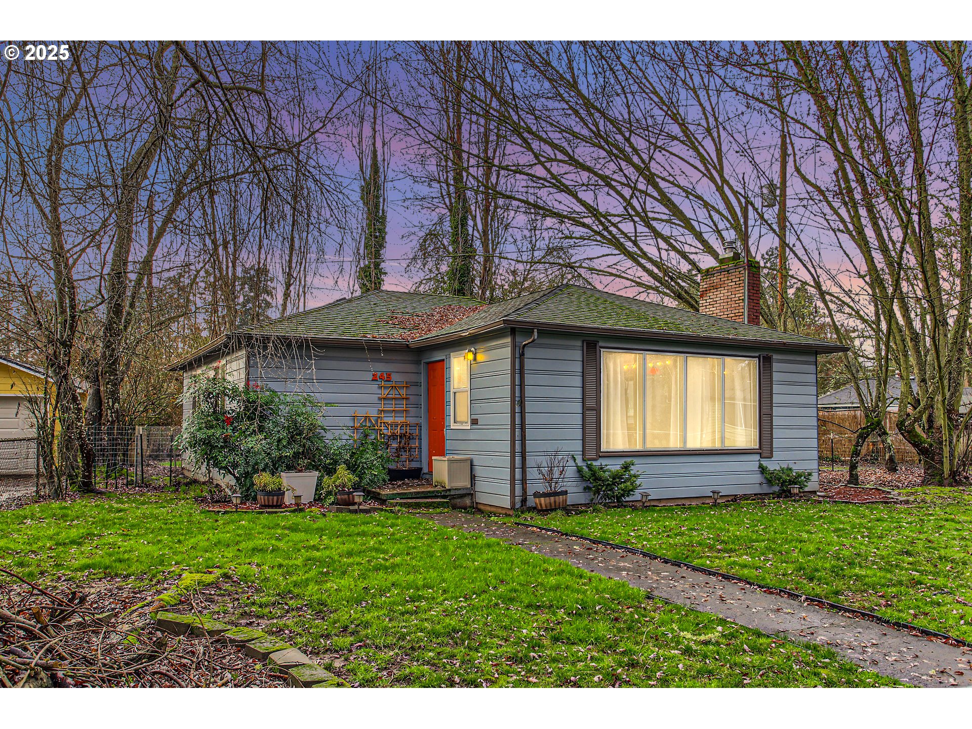 245 Southwest 133rd Avenue Beaverton, OR 97005 - Photo 1 of 12 a view of a house with a garden