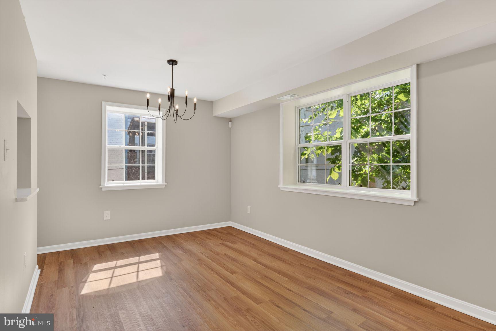 1008 Rittenhouse Street Northwest, Unit 15 Washington, DC 20011 - Photo 16 of 39 a view of livingroom with hardwood floor and window