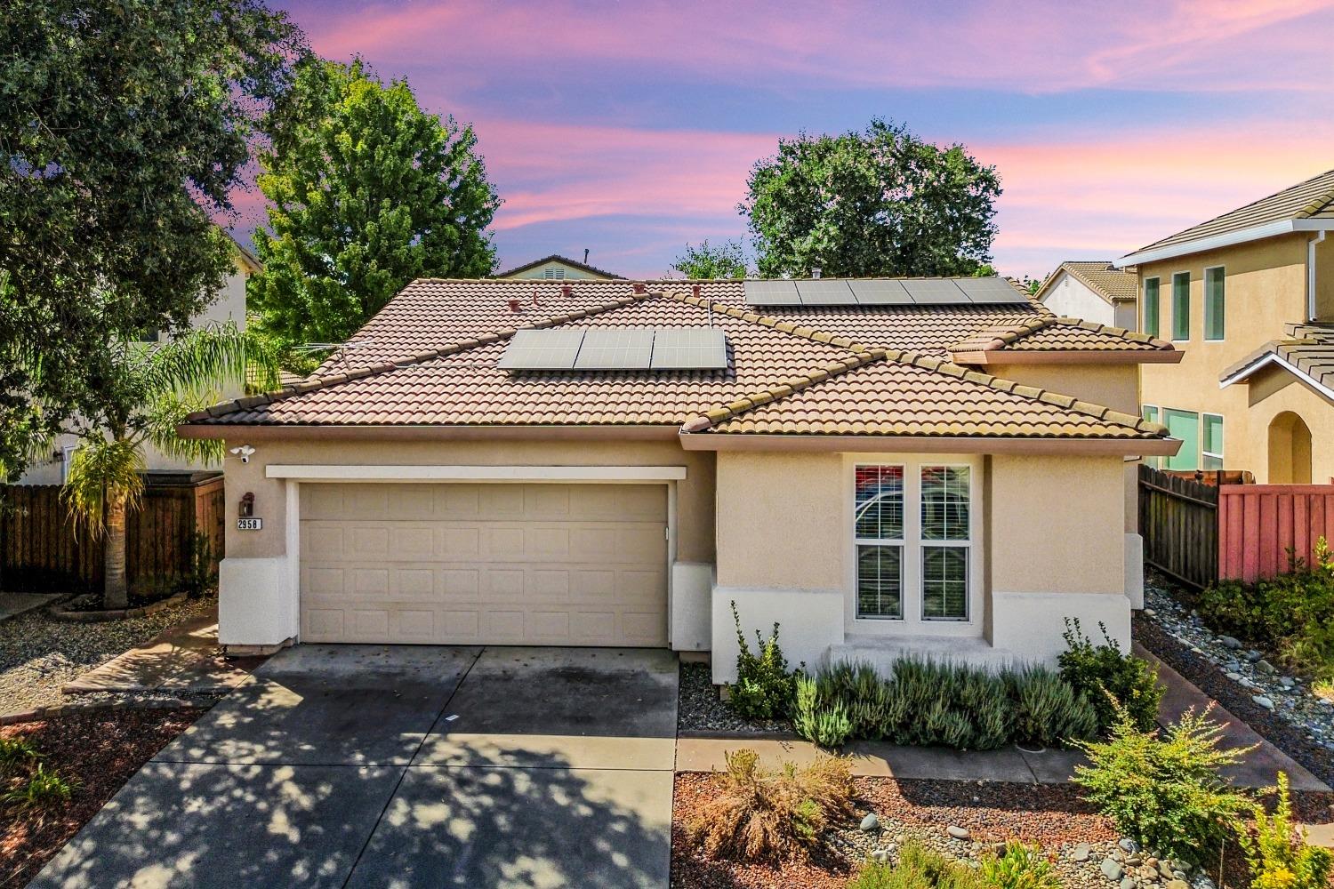2958 Quinter Way Sacramento, CA 95835 - Photo 1 of 1 a front view of a house with a yard