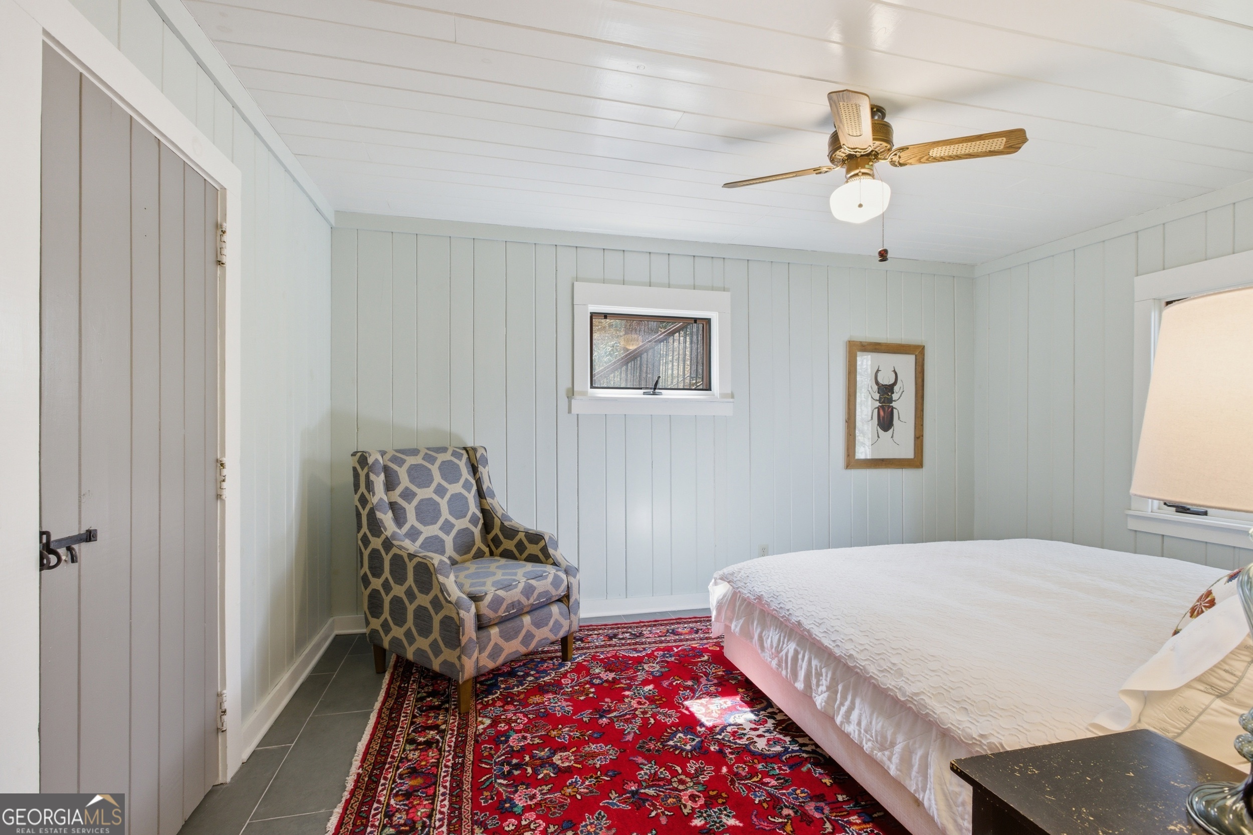 1921 Franklin Road Highlands, NC 28741 - Photo 36 of 72 a bedroom with a bed and a chandelier
