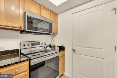 a kitchen with a stove and a microwave