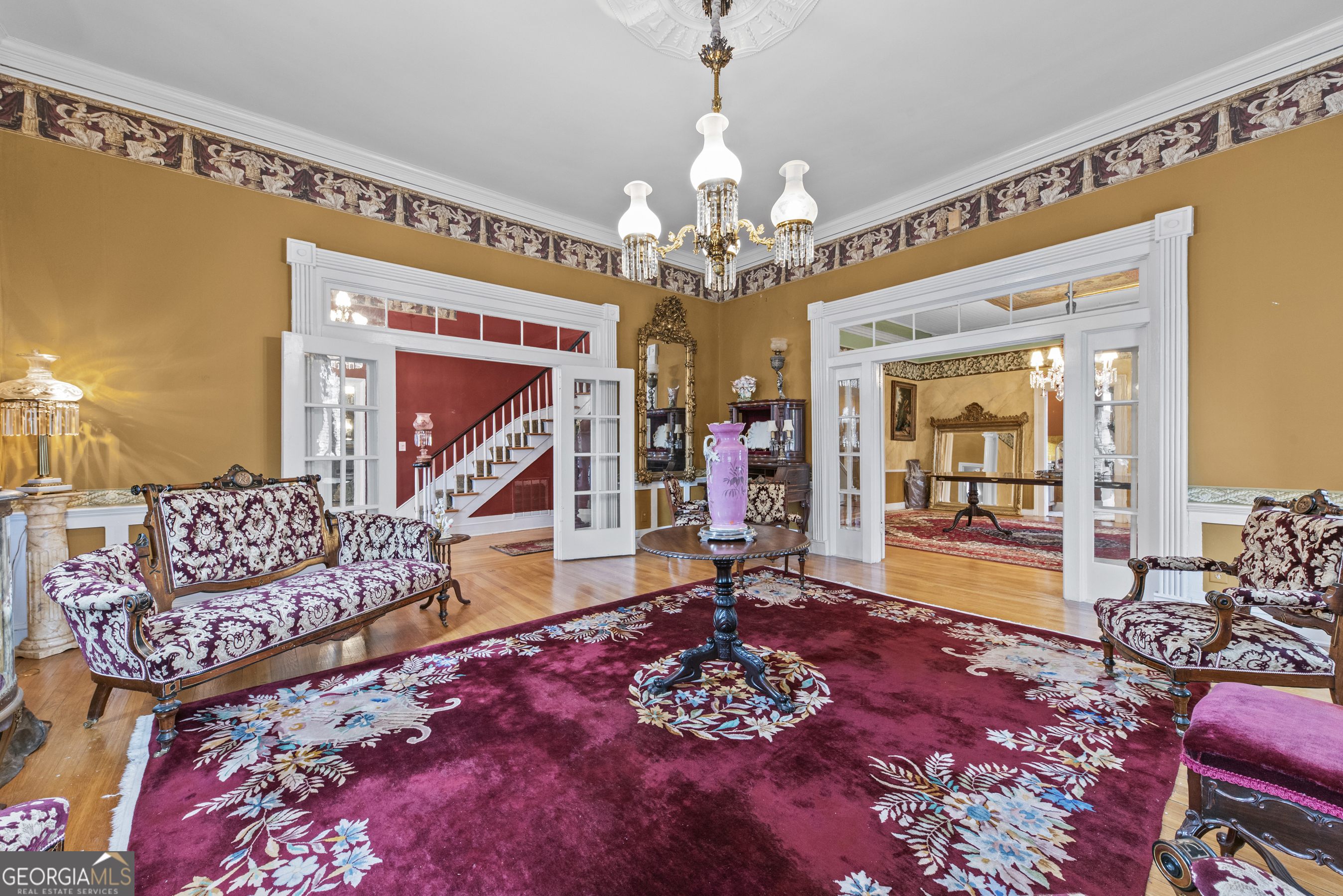 1155 Floyd Street Northeast Covington, GA 30014 - Photo 11 of 65 a living room with furniture and a chandelier