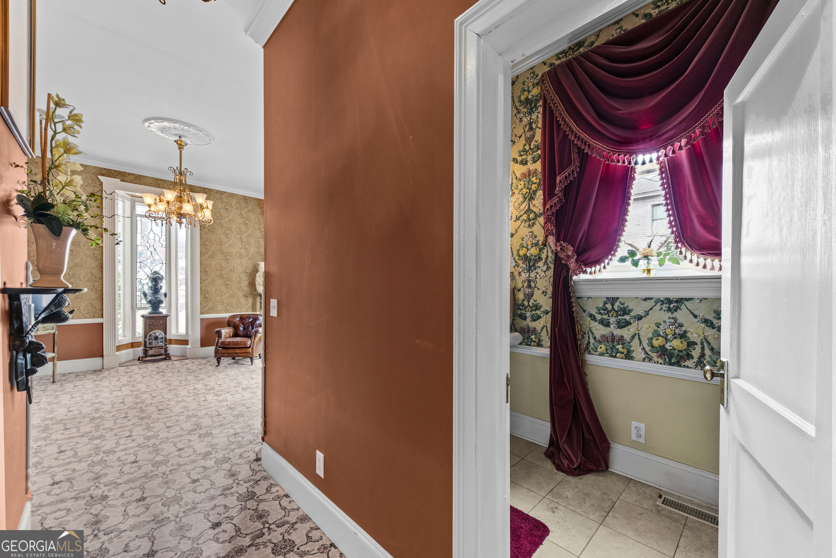 1155 Floyd Street Northeast Covington, GA 30014 - Photo 20 of 65 a view of a hallway with a dining table and chairs