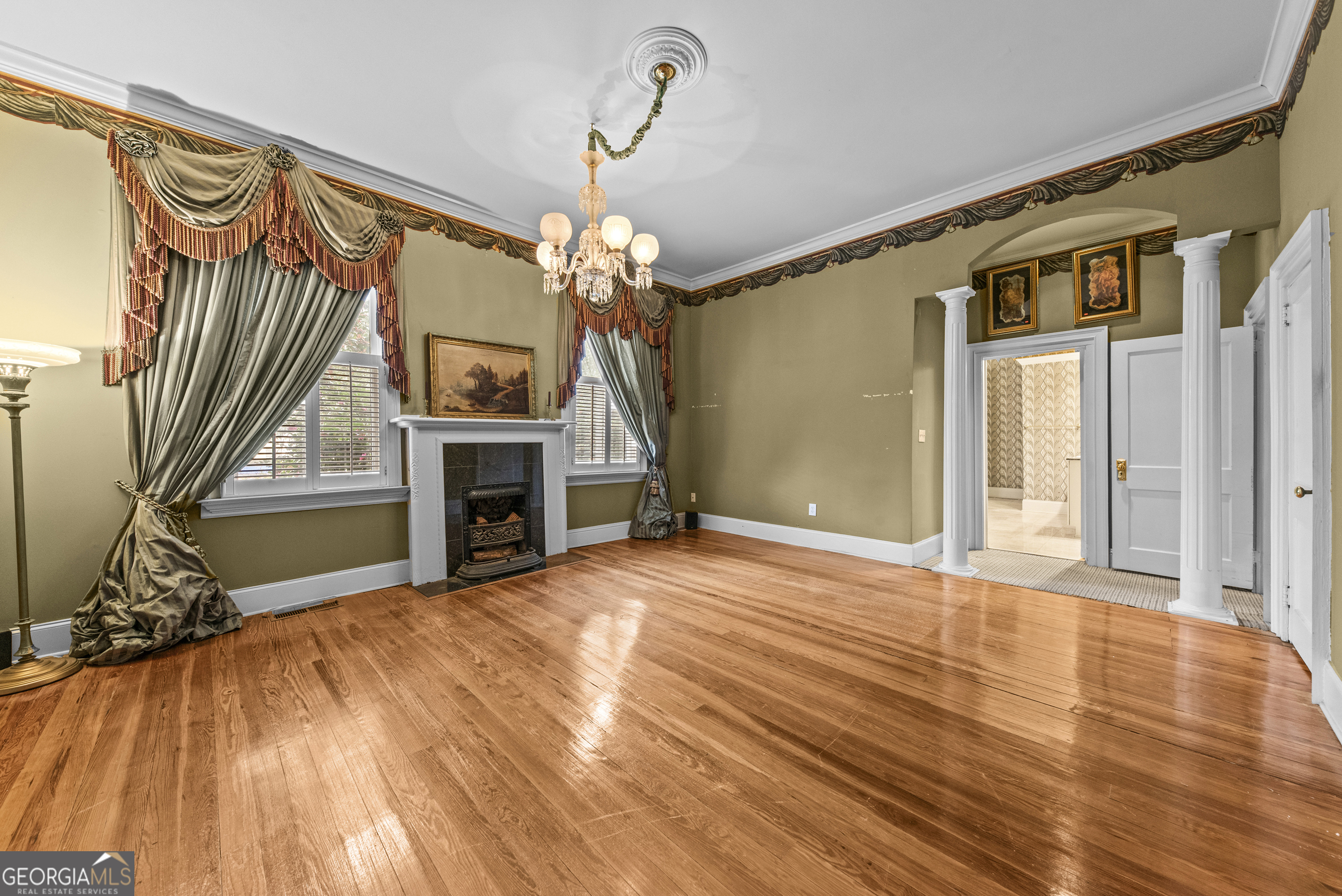 1155 Floyd Street Northeast Covington, GA 30014 - Photo 25 of 65 a view of a livingroom with wooden floor and a fireplace