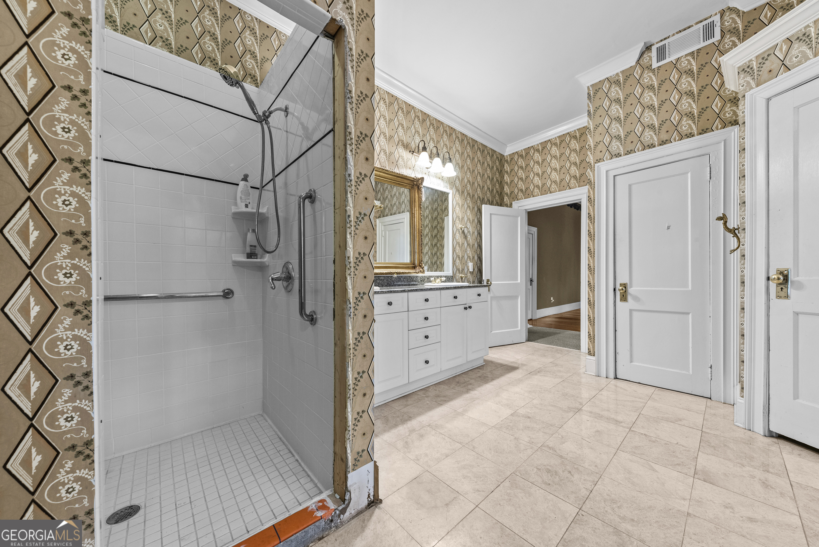 1155 Floyd Street Northeast Covington, GA 30014 - Photo 29 of 65 a bathroom with a glass door shower
