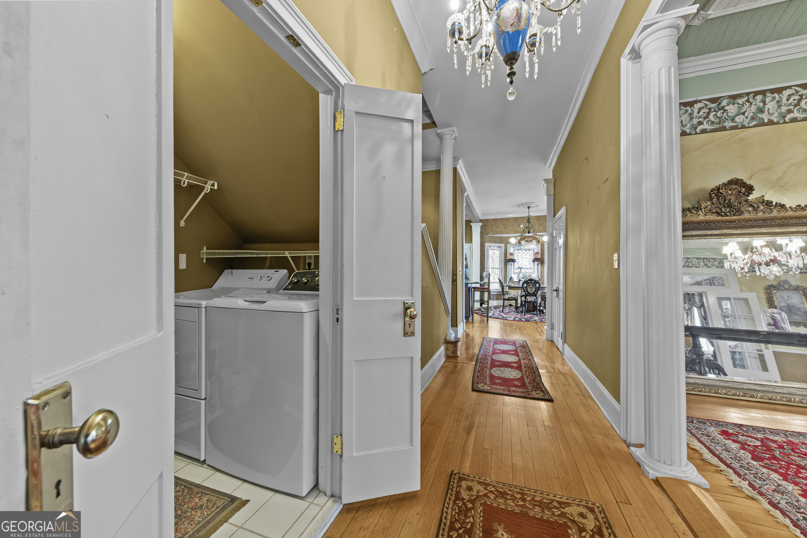 1155 Floyd Street Northeast Covington, GA 30014 - Photo 38 of 65 a view of a hallway view with furniture and chandelier