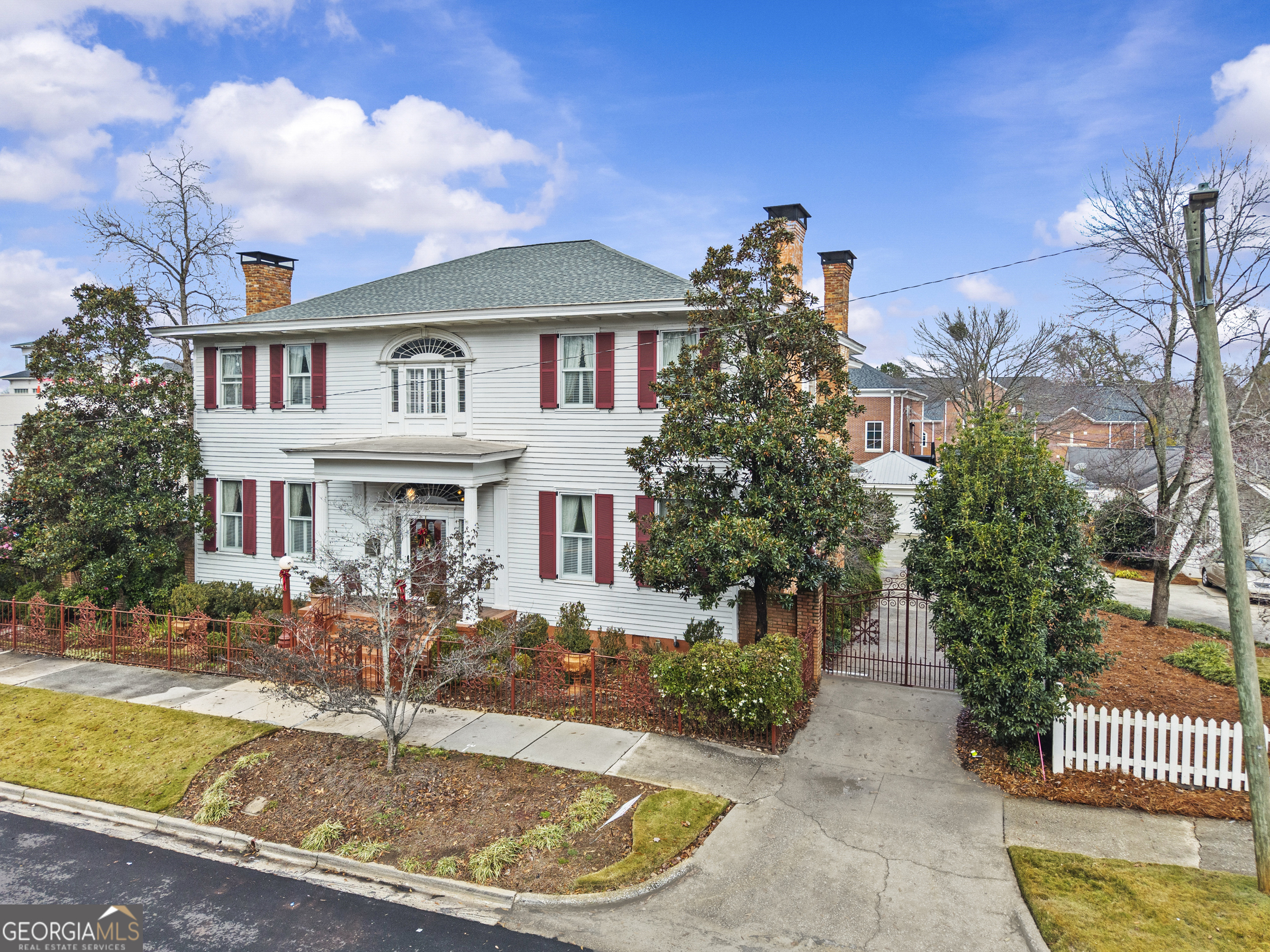 1155 Floyd Street Northeast Covington, GA 30014 - Photo 4 of 65 a front view of a house with a yard fountain