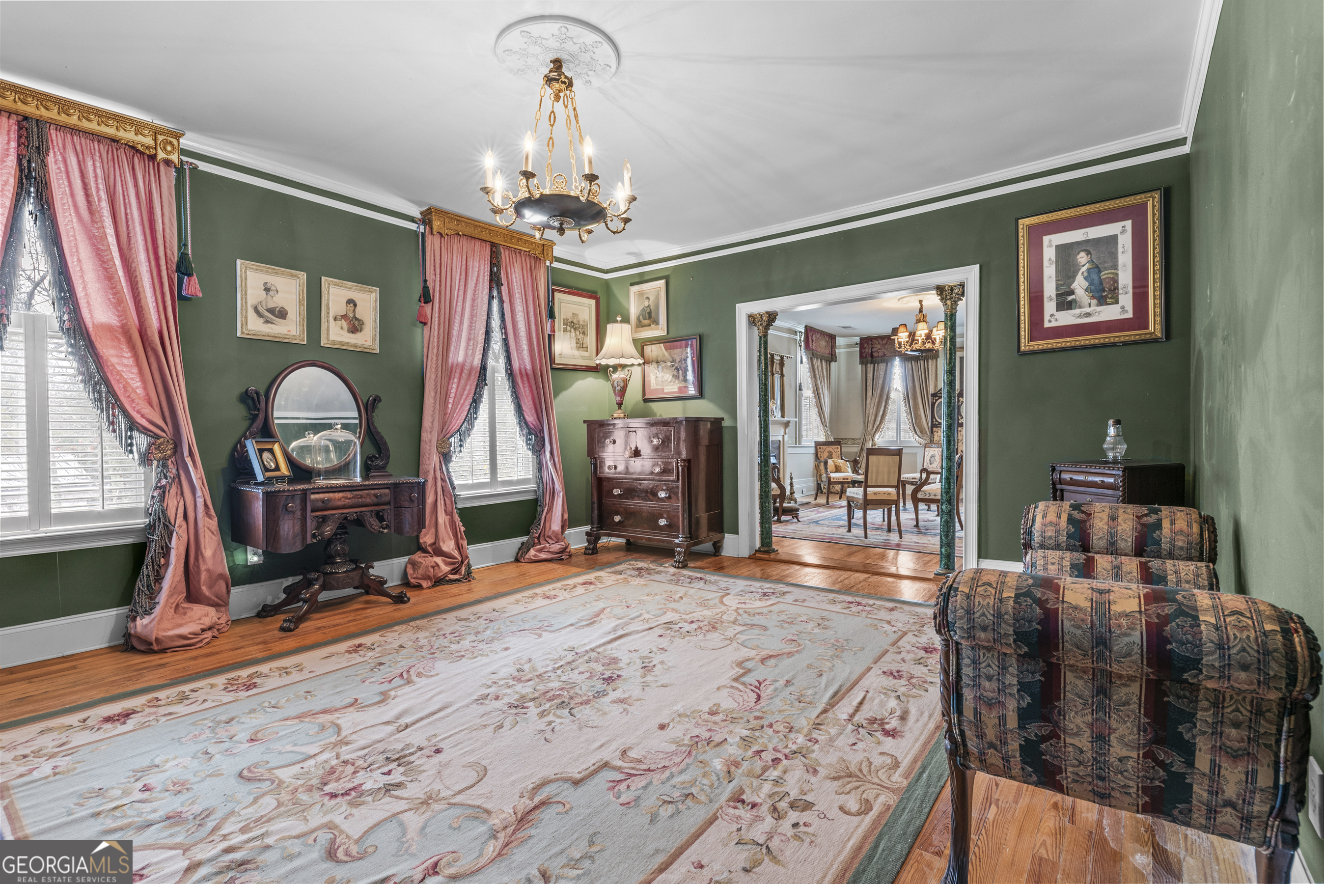 1155 Floyd Street Northeast Covington, GA 30014 - Photo 42 of 65 a view of a room with furniture chandelier and wooden floor