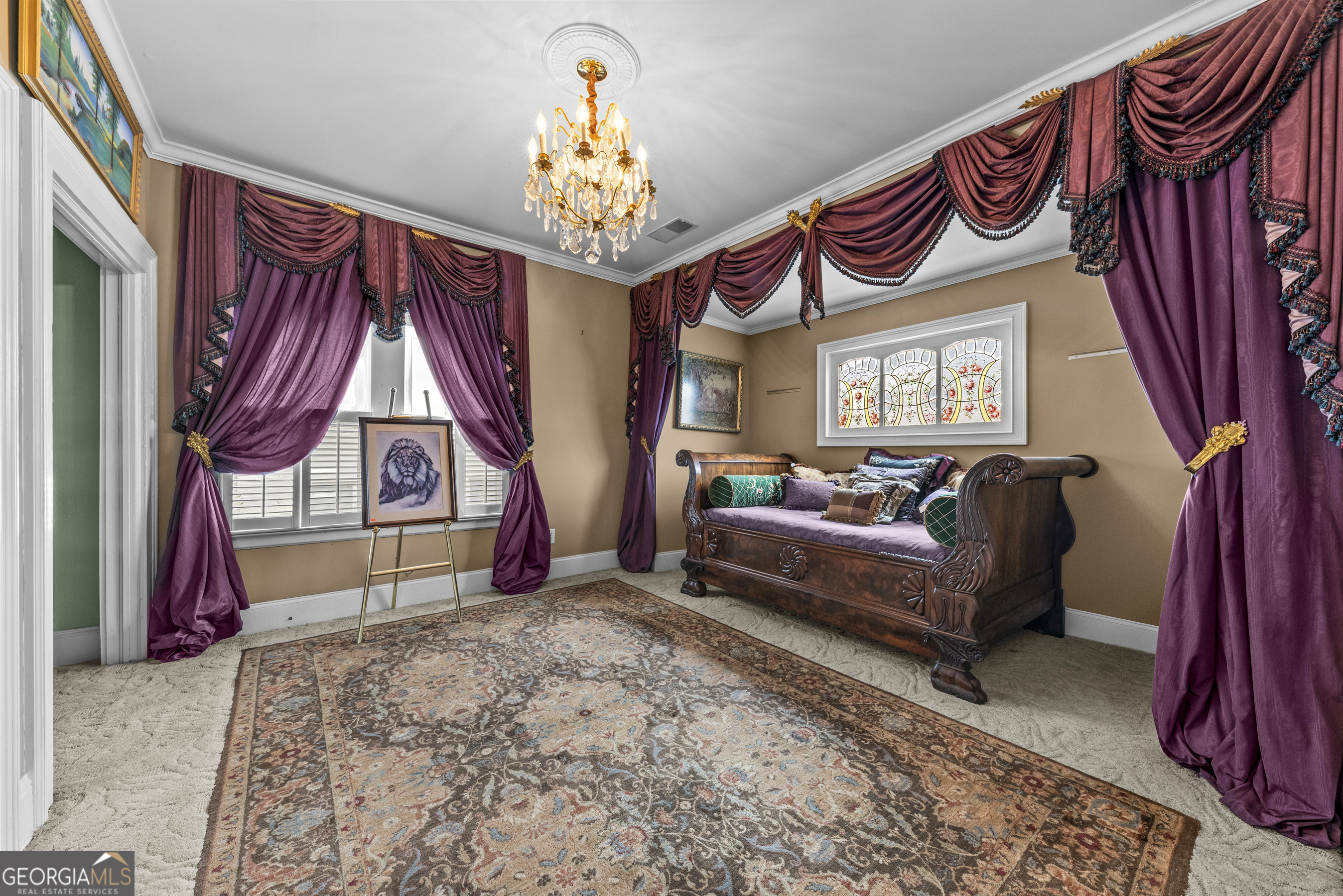 1155 Floyd Street Northeast Covington, GA 30014 - Photo 47 of 65 a bedroom with a bed and a chandelier