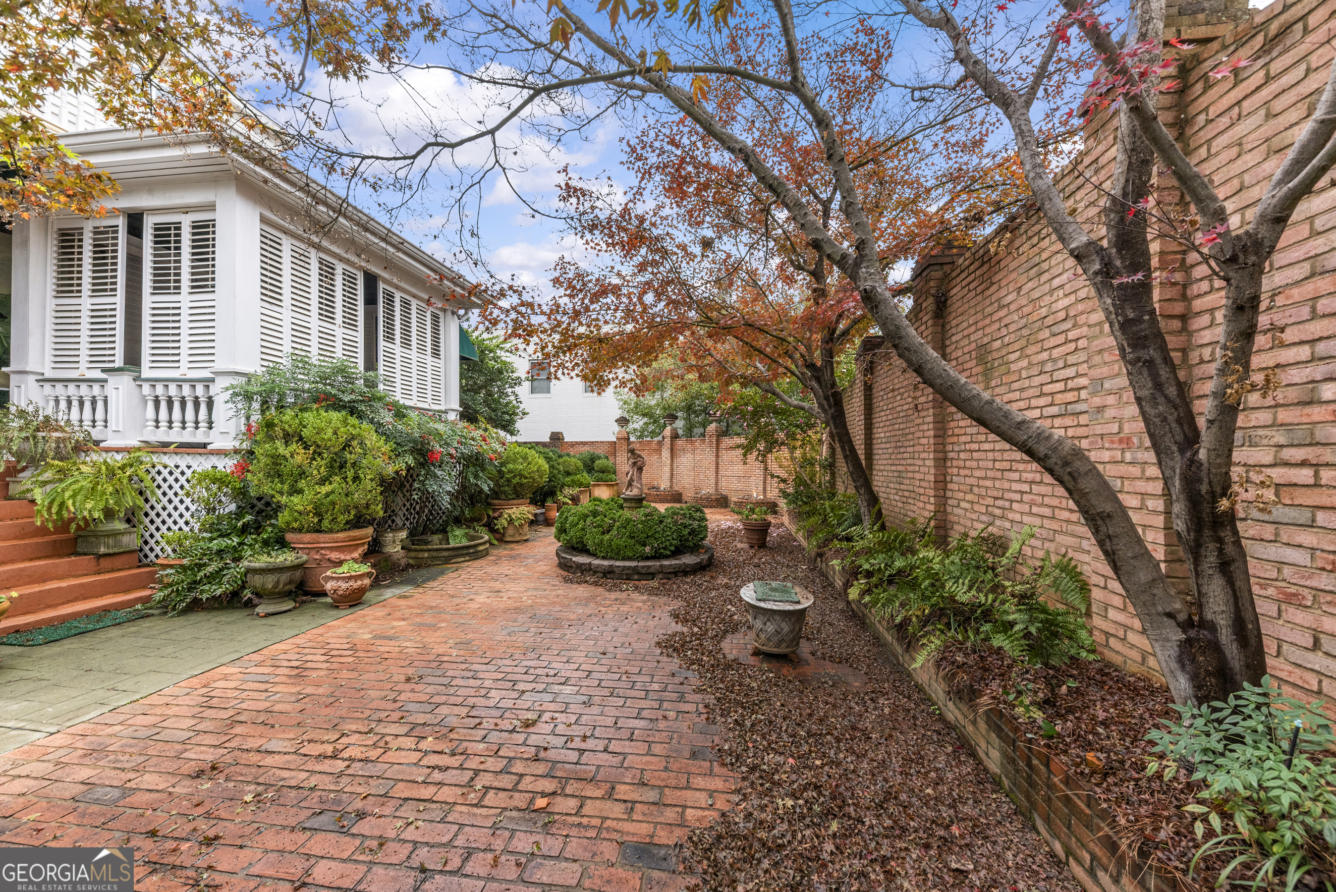1155 Floyd Street Northeast Covington, GA 30014 - Photo 64 of 65 a view of a backyard with potted plants and large trees