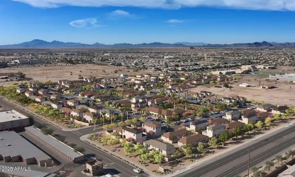 a view of a dining room with furniture and a chandelier
