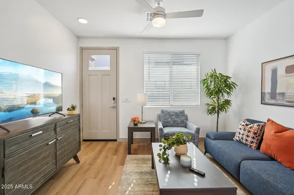 a living room with furniture and a large window