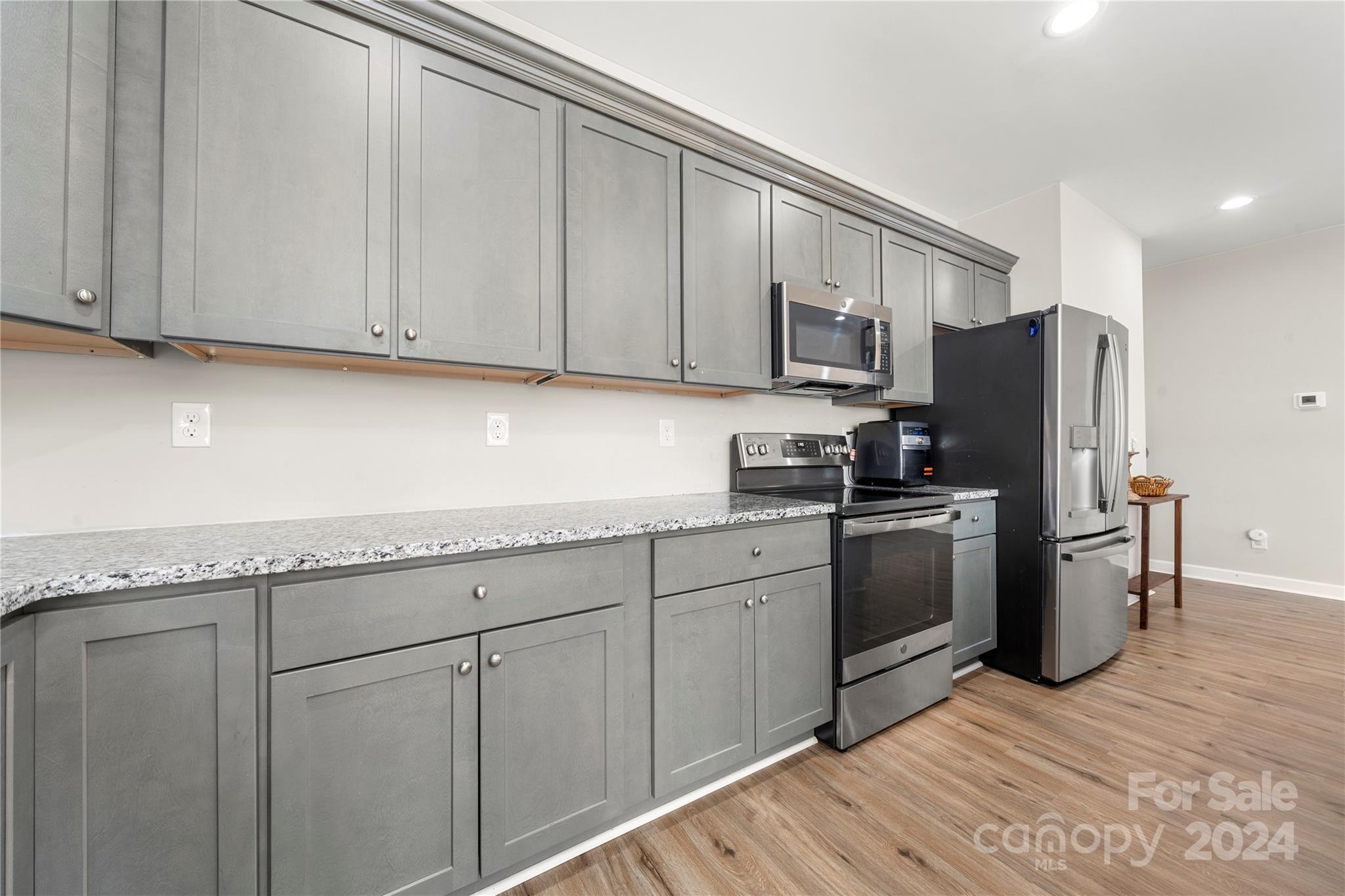 218 Rambler Lane Blacksburg, SC 29702 - Photo 14 of 42 a kitchen with stainless steel appliances granite countertop a refrigerator sink and cabinets