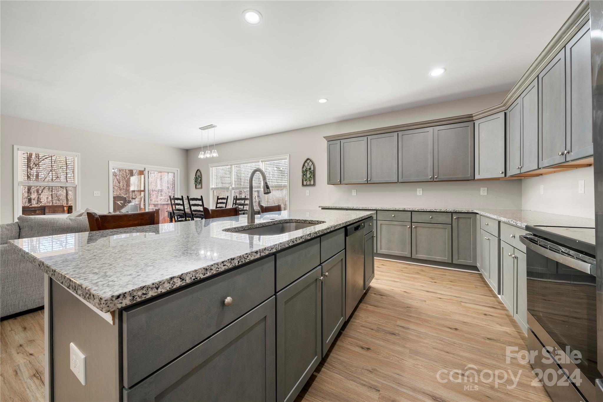 218 Rambler Lane Blacksburg, SC 29702 - Photo 15 of 42 a kitchen with stainless steel appliances granite countertop a sink dishwasher stove and refrigerator with wooden floor